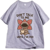 T-shirt démogorgon humour en coton gris chiné avec illustration cartoon du démogorgon tenant une tasse et texte humour culture pop