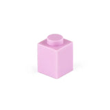 Une brique lego 1x1 rose tendre avec un plot circulaire assorti dans un ensemble 50pcs bloc construction lego