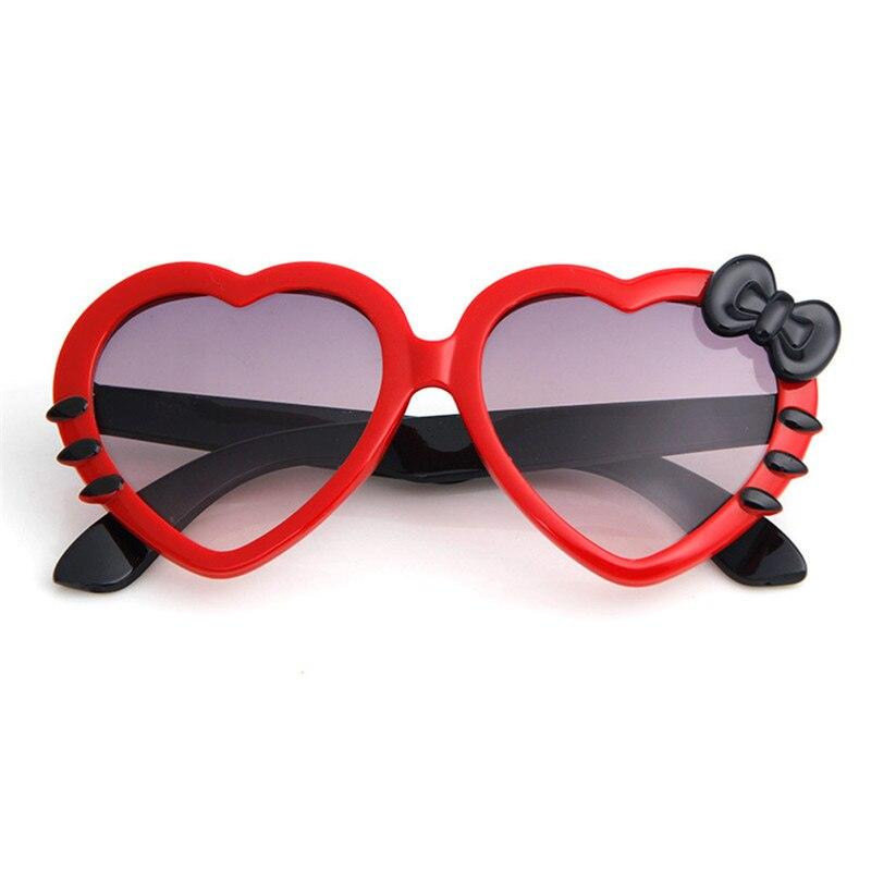 Lunette de soleil en coeur et noeud de papillon