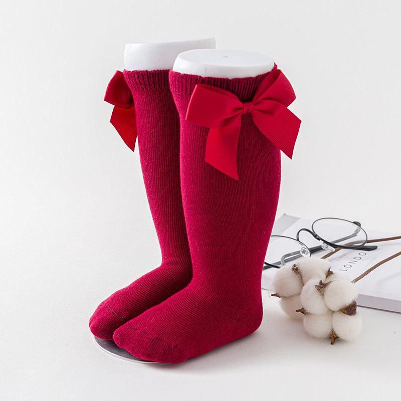 Red baby socks with bow ties