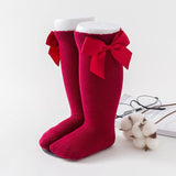 Red baby socks with bow ties