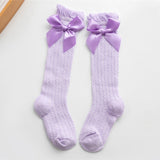 Calzini alti a farfalla per neonata