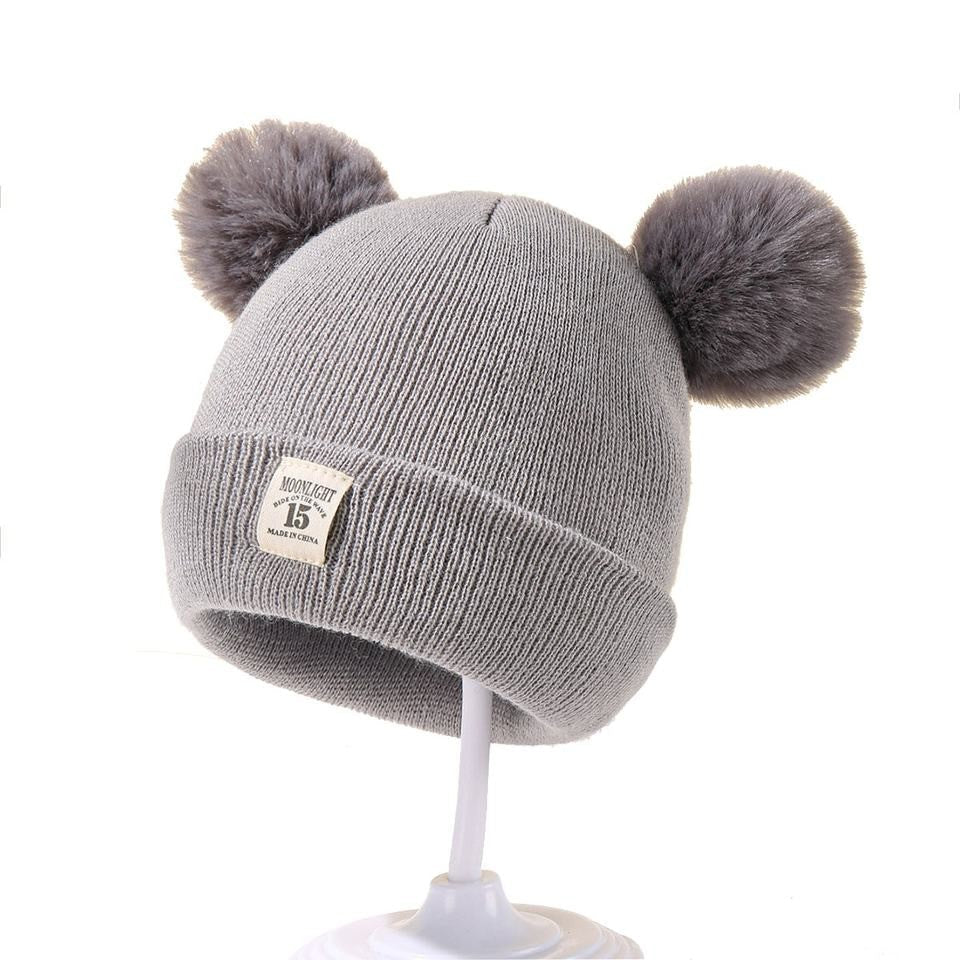 Berretto in maglia con pompon