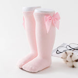 Paire de chaussette rose avec noeuds de papillon