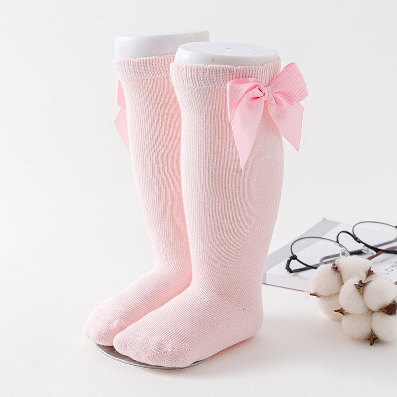 Paire de chaussette rose avec noeuds de papillon