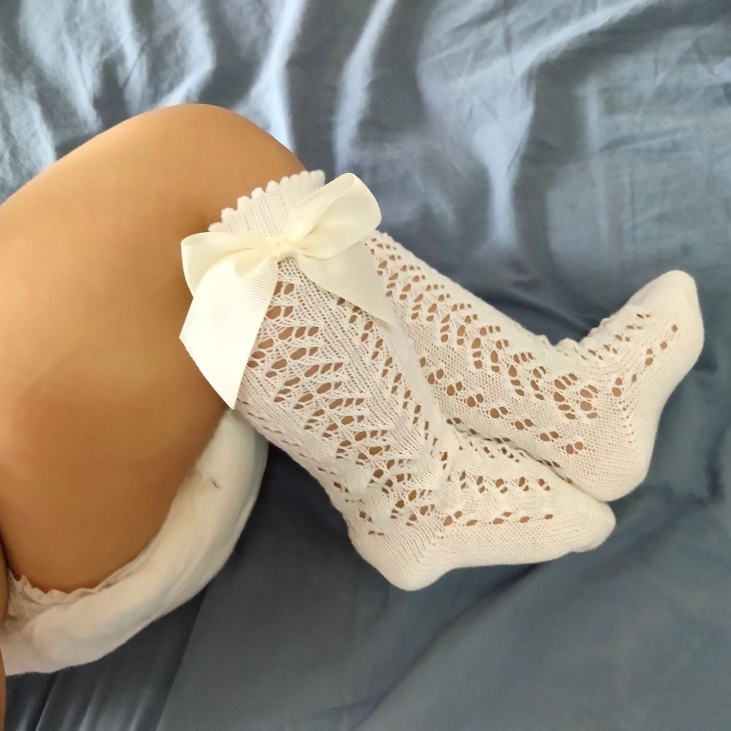 Calzini alti a farfalla per neonata
