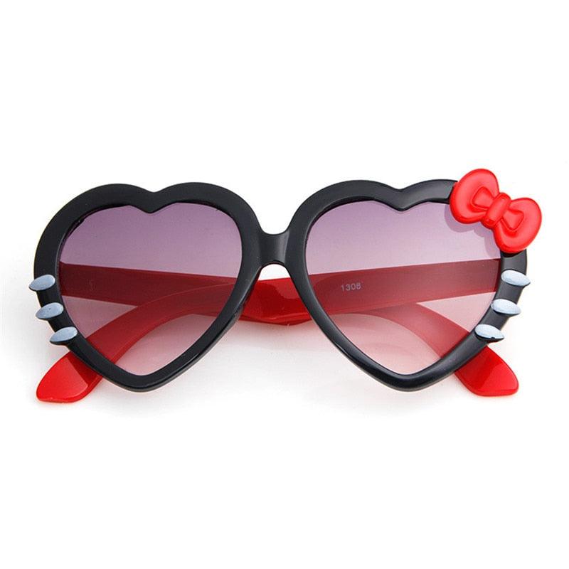 Lunette de soleil en coeur et noeud de papillon