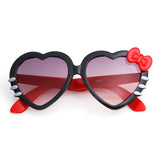 Lunette de soleil en coeur et noeud de papillon
