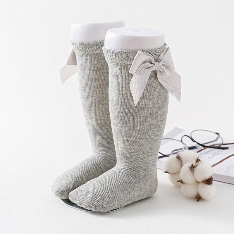 Pair of gray socks with bow ties