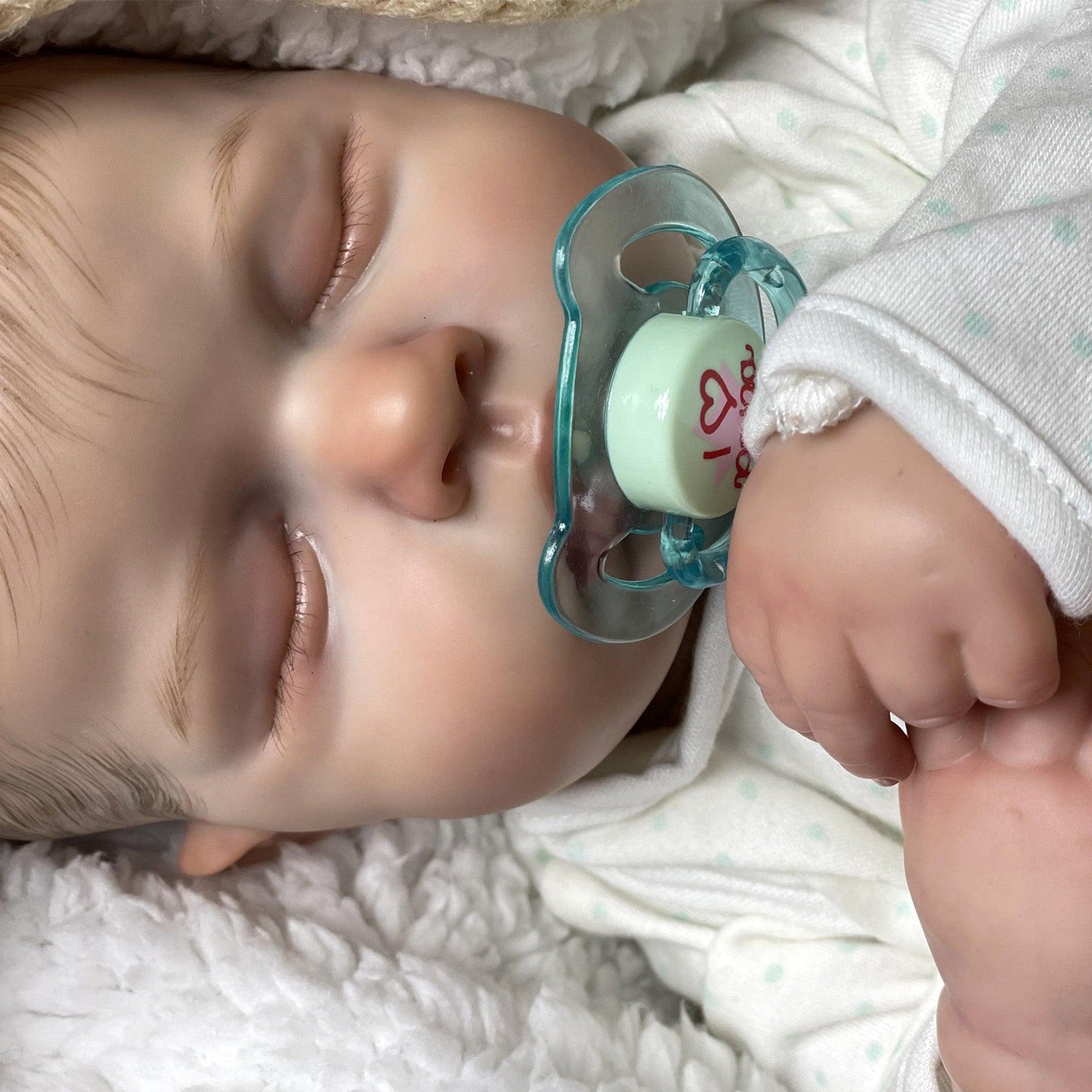 Reborn baby boy with closed eyes - Leo
