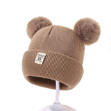 Berretto in maglia con pompon