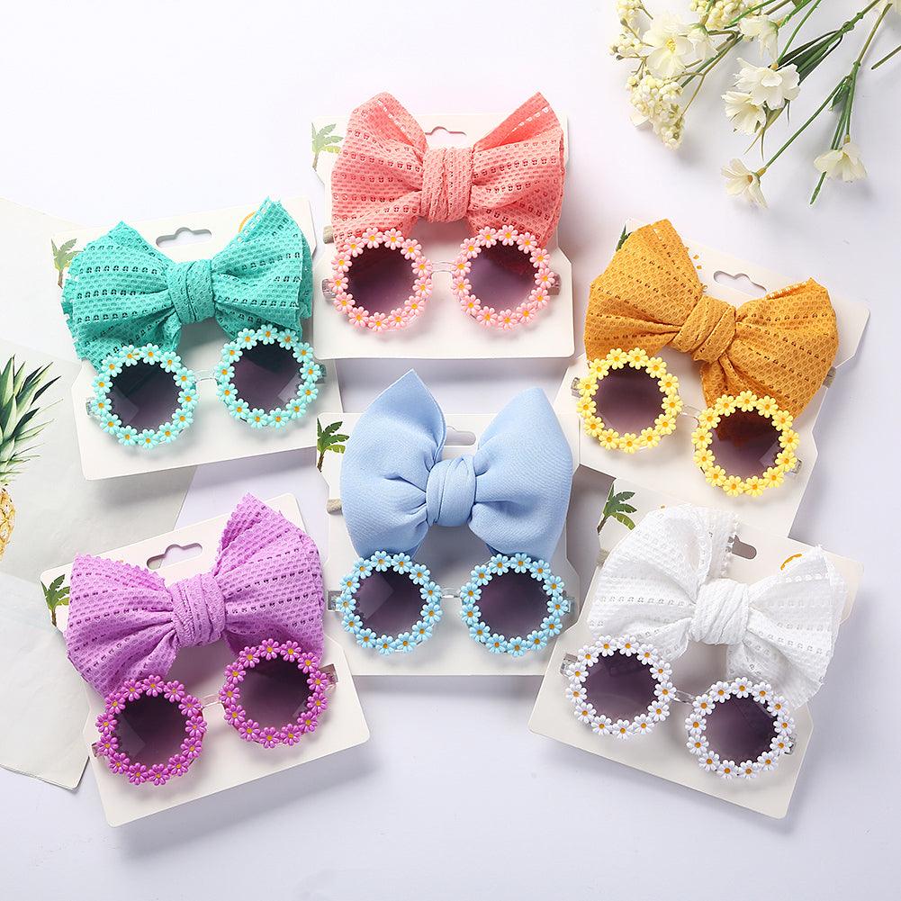 Lunettes de soleil en forme de marguerite + noeud de papillon
