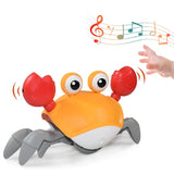 Giocattolo musicale a forma di granchio gattonante