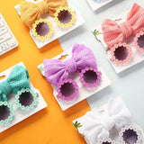 Lunettes de soleil en forme de marguerite + noeud de papillon