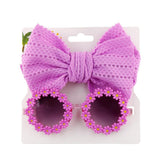 Lunettes de soleil en forme de marguerite + noeud de papillon