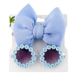 Lunettes de soleil en forme de marguerite + noeud de papillon