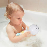 Light-up whale bath toy