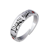Bague anime death note en argent ajustable avec gravure death note noire et deux pierres rouges sur les côtés