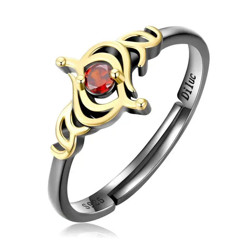 Bague genshin impact en argent noir et or avec un design orné de couronne et une pierre rouge centrale