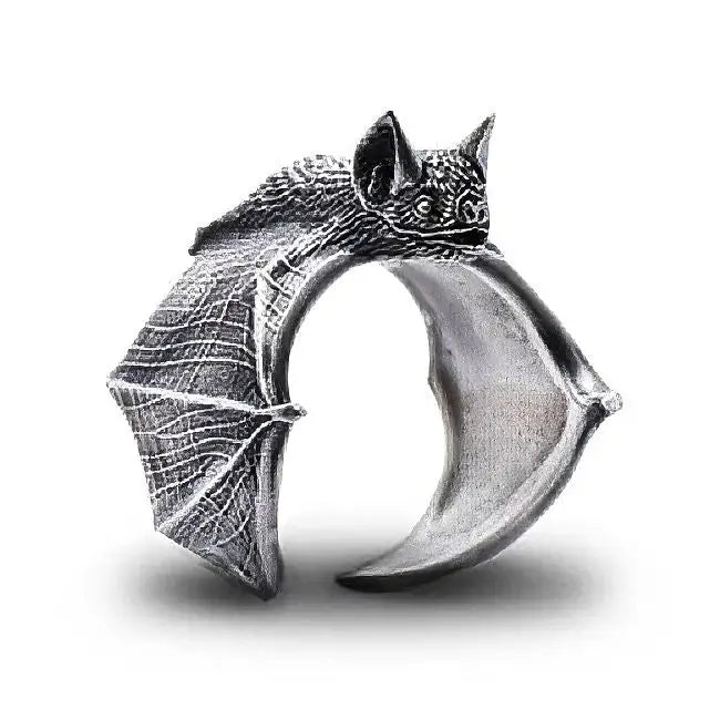 Bague chauve-souris argentée en métal texturé avec ailes et visage détaillés idéale pour déguisement carnaval magasins de jouets