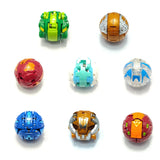 Une collection de bakugan jouet boules transformables en plastique coloré avec divers designs et teintes vives