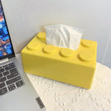 Boîte à mouchoirs lego de couleur jaune vif avec finition glossy et picots circulaires sur le dessus