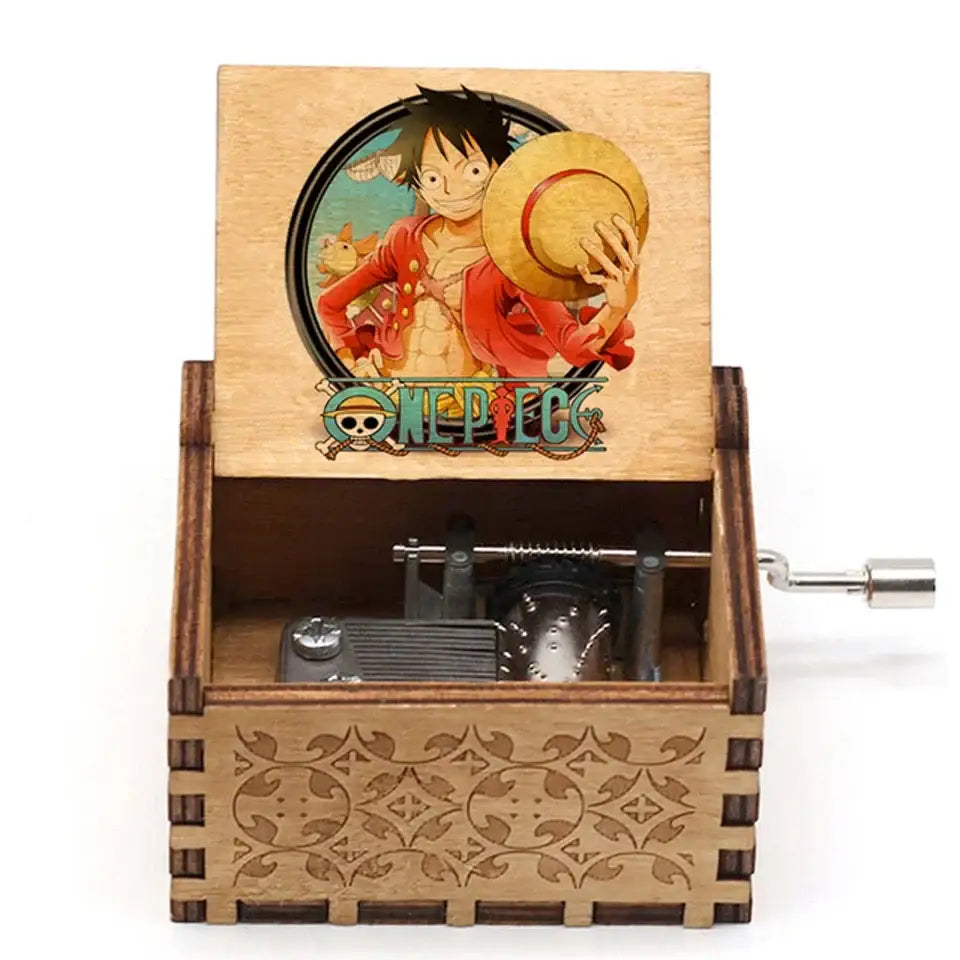 Boîte à musique one piece en bois avec illustration circulaire de luffy tenant son chapeau de paille et motifs sculptés