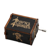 Boîte à musique noire en bois avec logo doré legend of zelda breath of the wild et manivelle argentée pour mélodie d hyrule
