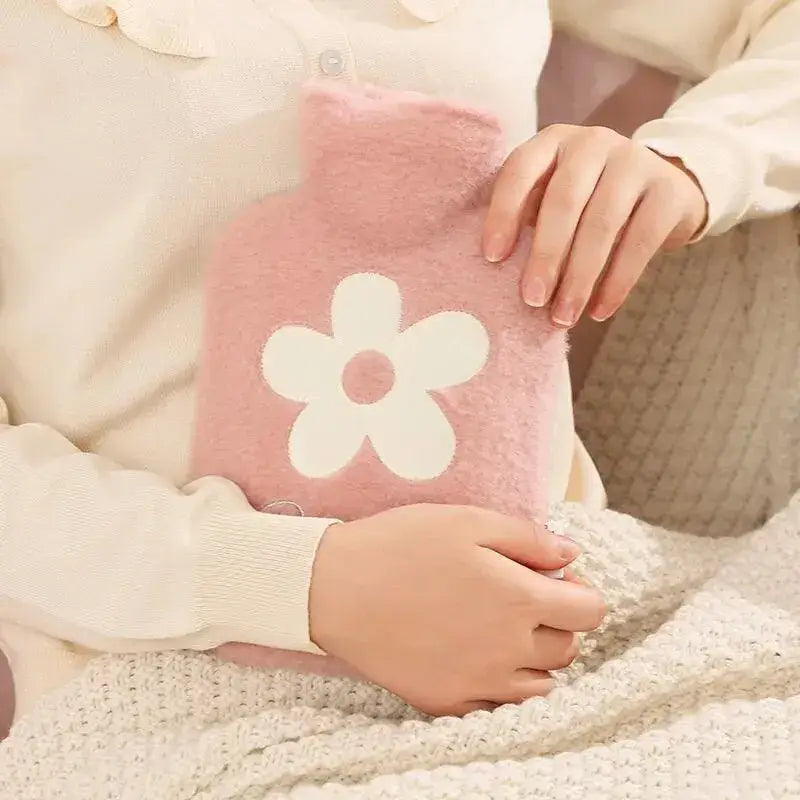 Hot water bottle with plush cover