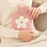 Hot water bottle with plush cover