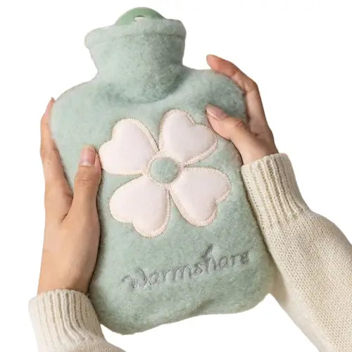 Hot water bottle with plush cover