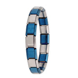 Bracelet à breloques en acier inoxydable incarne l’alliance parfaite entre design modulaire et matériau résistant bleu et argent