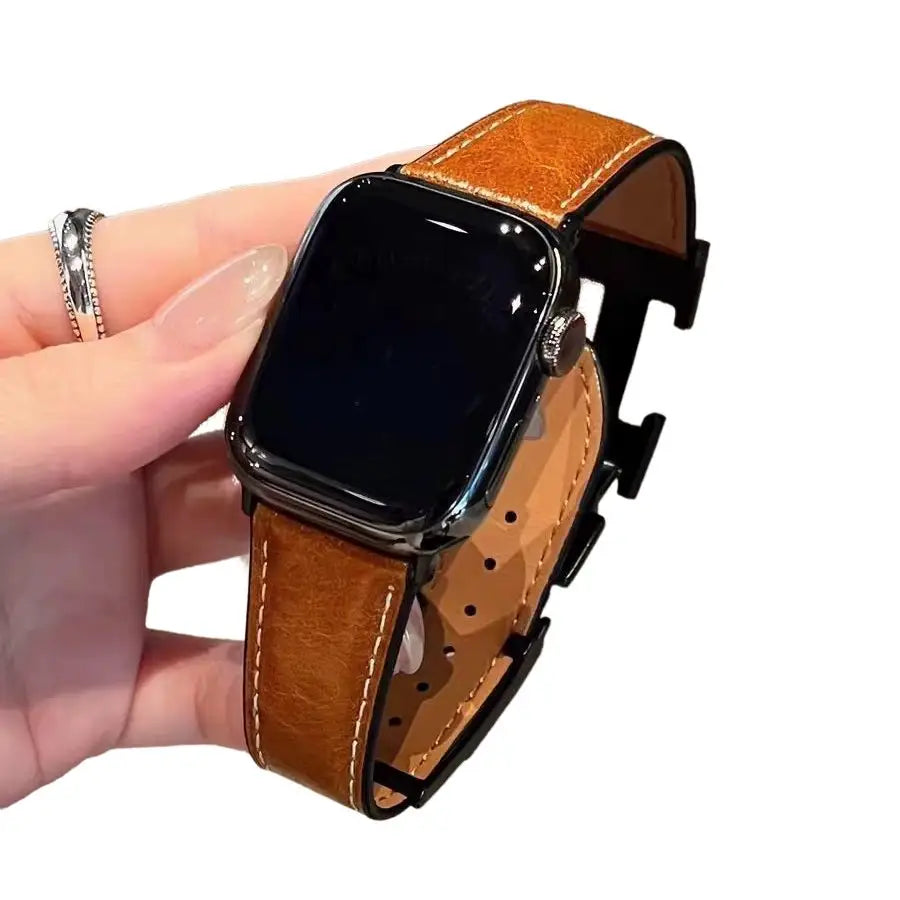 Bracelet apple watch hermès cuir en cuir tan avec surpiqûres blanches et boucle noire en plastique pour événements spéciaux