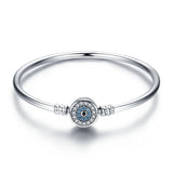 Bracelet argent amour en argent orné d un charme oeil bleu avec cristaux bleus et clairs au centre