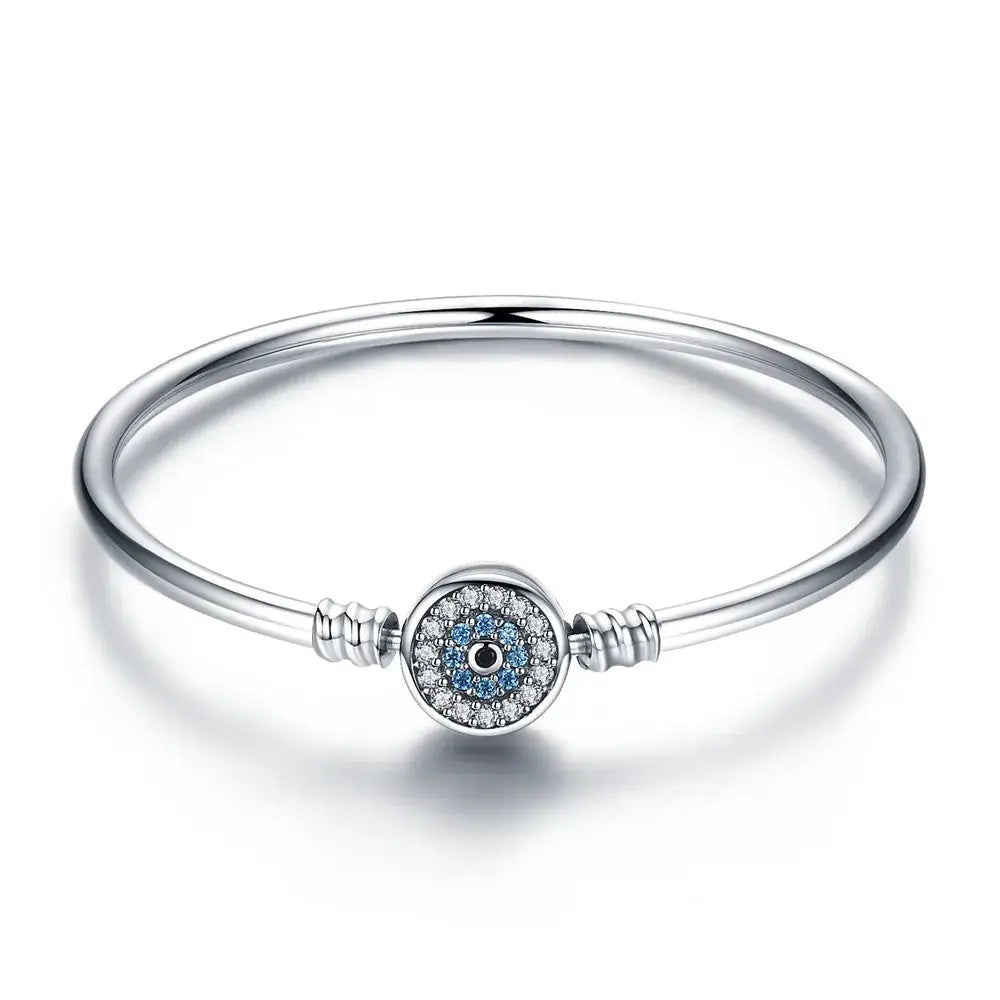 Bracelet argent amour en argent orné d un charme oeil bleu avec cristaux bleus et clairs au centre