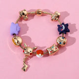Bracelet breloques personnage pokémon en métal doré avec breloques pikachu, gengar et poké ball colorées