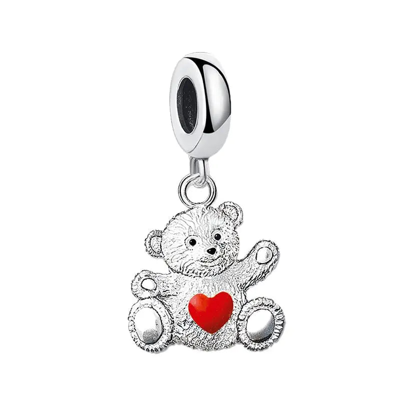 Breloque amour argent en forme de nounours en argent avec un charm collier nounours et un cœur rouge symbole d’amour