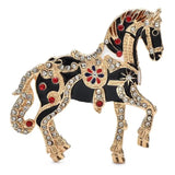 Broche animal cheval luxe noire et dorée ornée de strass rouges et clairs bijou raffiné cheval luxe