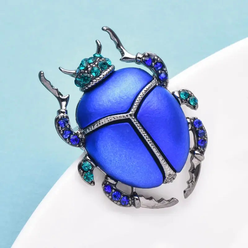 Elegant blue scarab brooch