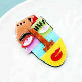 Picasso-style face brooch