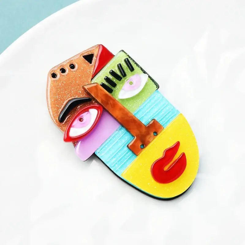 Picasso-style face brooch