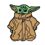 Broches pins star wars en émail vert et beige représentant le personnage grogu de star wars
