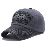 Casquette mode original unisexe en tissu durable gris foncé avec lettre original the black brodée et coutures blanches