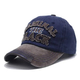 Casquette mode original unisexe en tissu durable bleu marine avec visière grise et broderie originale en fil noir effet usé
