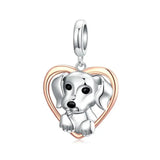 Charm chien argent en forme de cœur en argent et or rose avec un chiot détaillé pour bracelet chiens argent et touche d’élégance