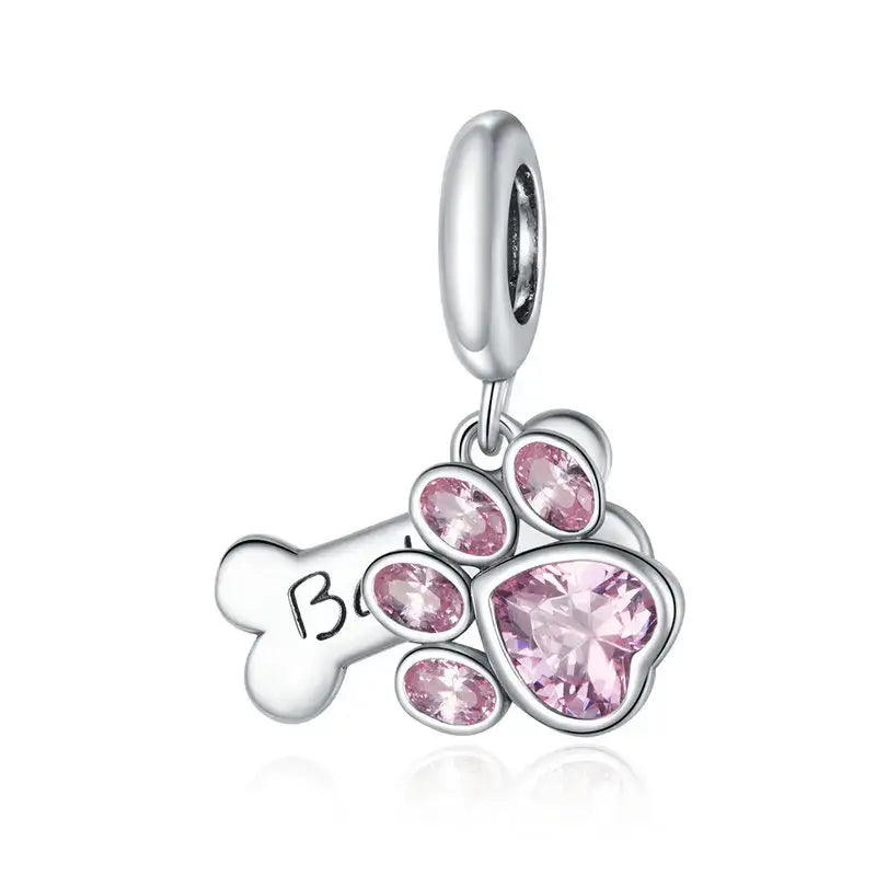 Charms pour bracelet chiens argent avec plaque patte et os en argent ornés de pierres roses pour une touche d’élégance