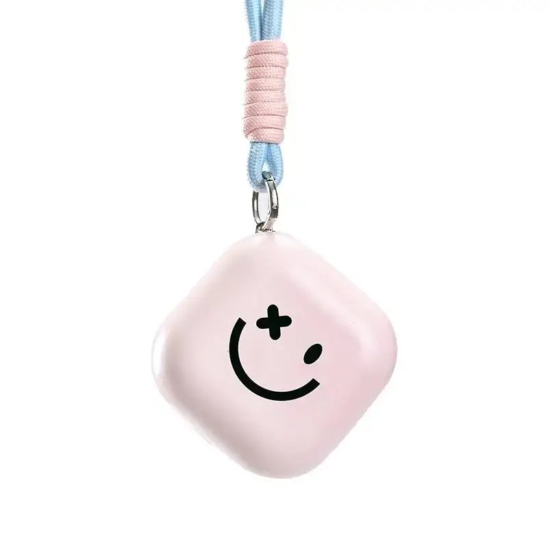 Chauffe-mains rechargeable rose en forme de losange avec visage souriant noir et cordon bleu pour mains chaudes hiver doux restez