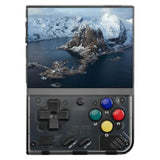 Console retro portable transparent noir avec écran vibrant affichant montagnes enneigées et boutons colorés a b x y
