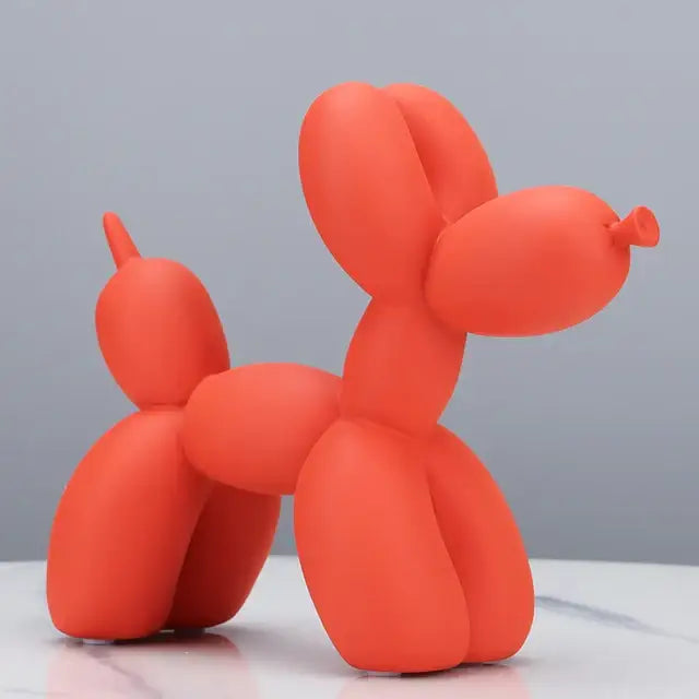 Décoration moderne en résine chien ballon orange vif en silicone lisse et brillant avec design stylisé ludique