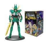 Figurine chevaliers du zodiaque en armure verte et or posée sur socle noir disponible en magasins de jouets